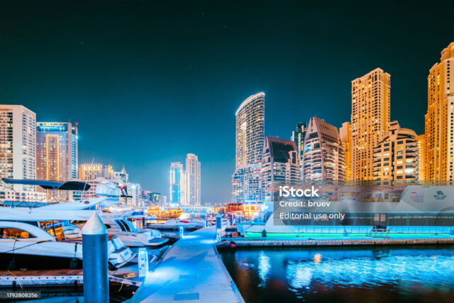 A bustling waterfront community with high-rise apartments and dynamic nightlife